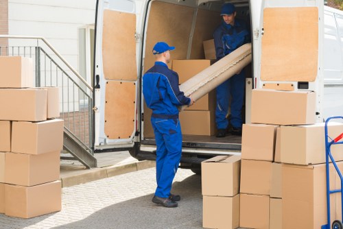Removal company team preparing furniture for a UK house move