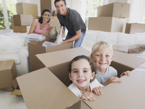 Team planning an office removal in Uxbridge with packed boxes and office furniture