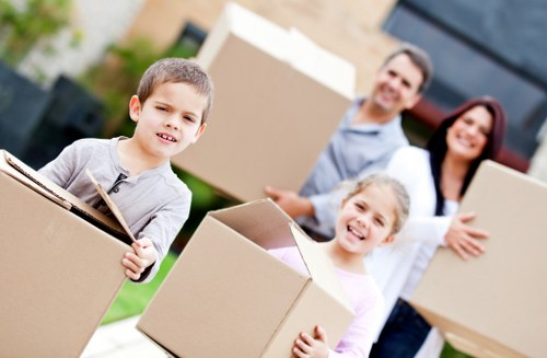 Local moving team organising boxes for a Uxbridge property