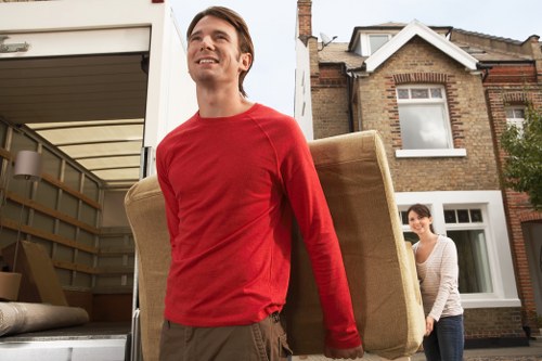 Professional movers loading furniture during a same day relocation