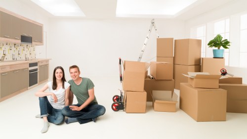 Trained movers handling furniture carefully during a Uxbridge removal